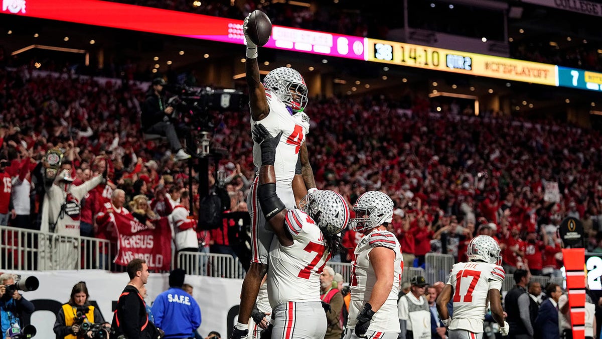 Jeremiah Smith elevates after scoring a touchdown