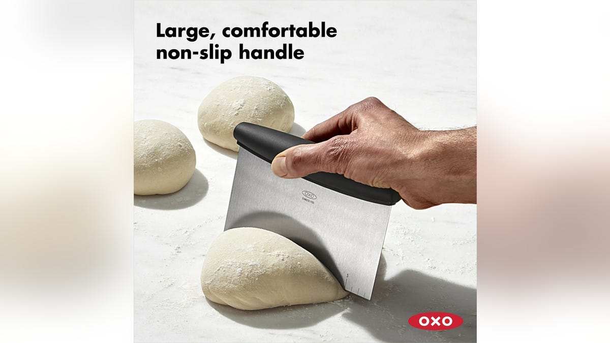 Use a bench scraper to help disperse your dough balls.