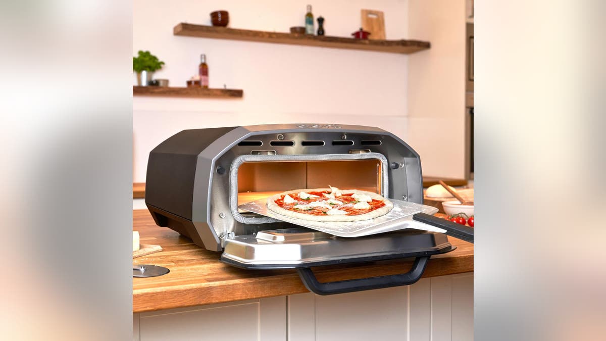 This Ooni oven makes a stone-baked pizza in 90 seconds.