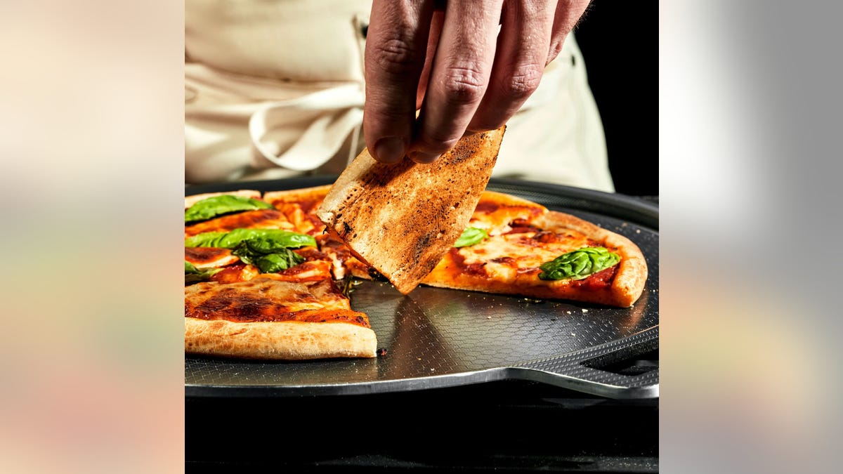 Try this HexClad Hybrid Pizza Steel that can withstand high temperatures.