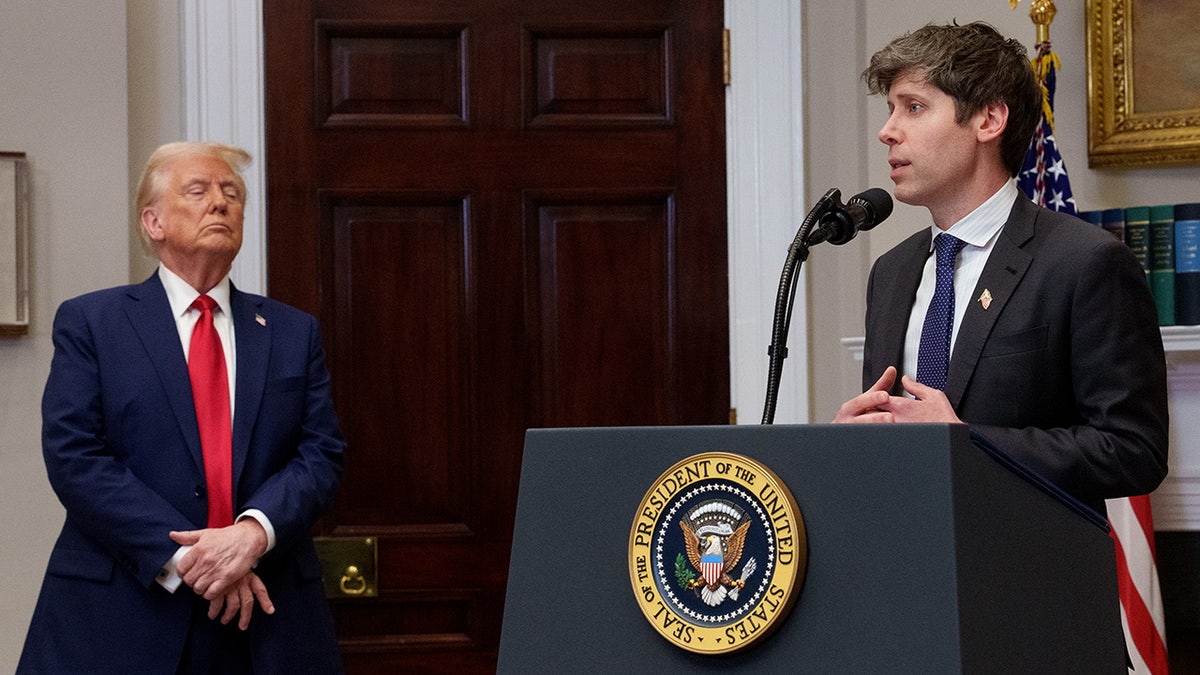 OpenAI CEO Sam Altman, accompanied by U.S. President Donald Trump, speaks during a news conference