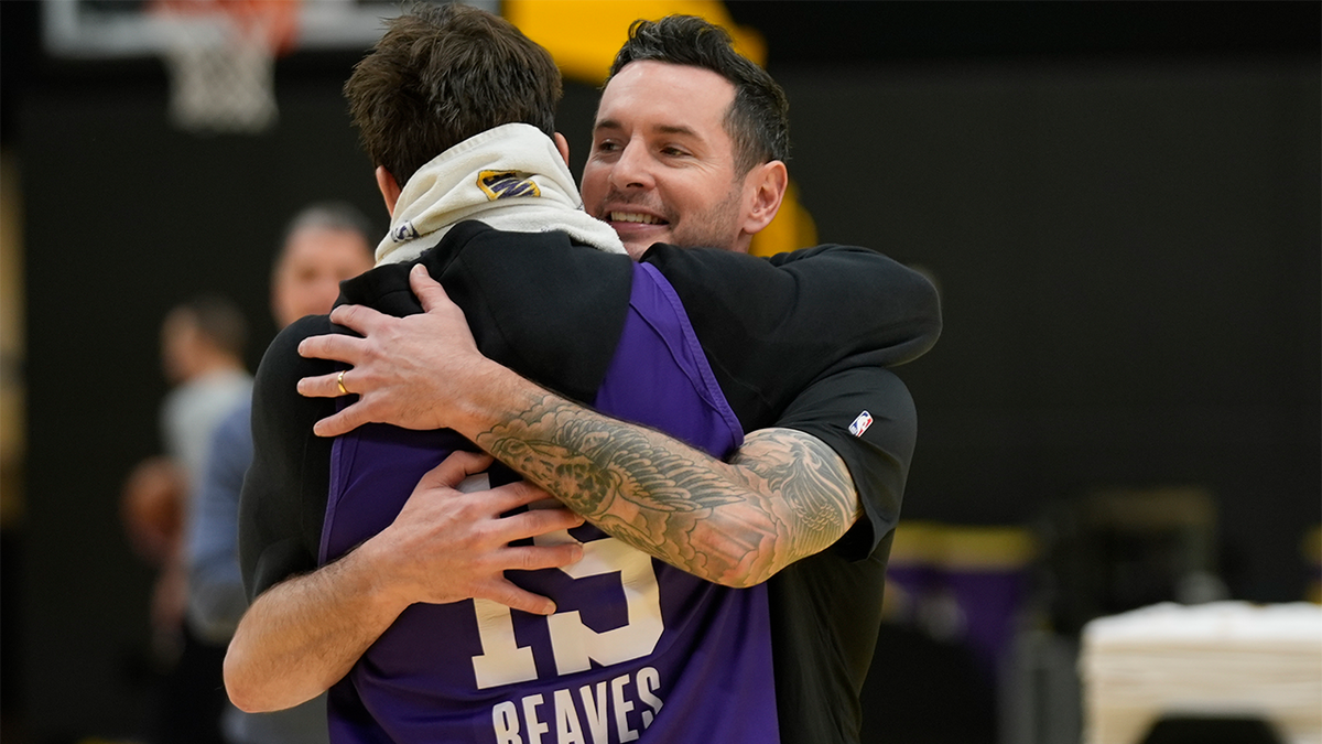 JJ Redick hugged by Austin Reeves