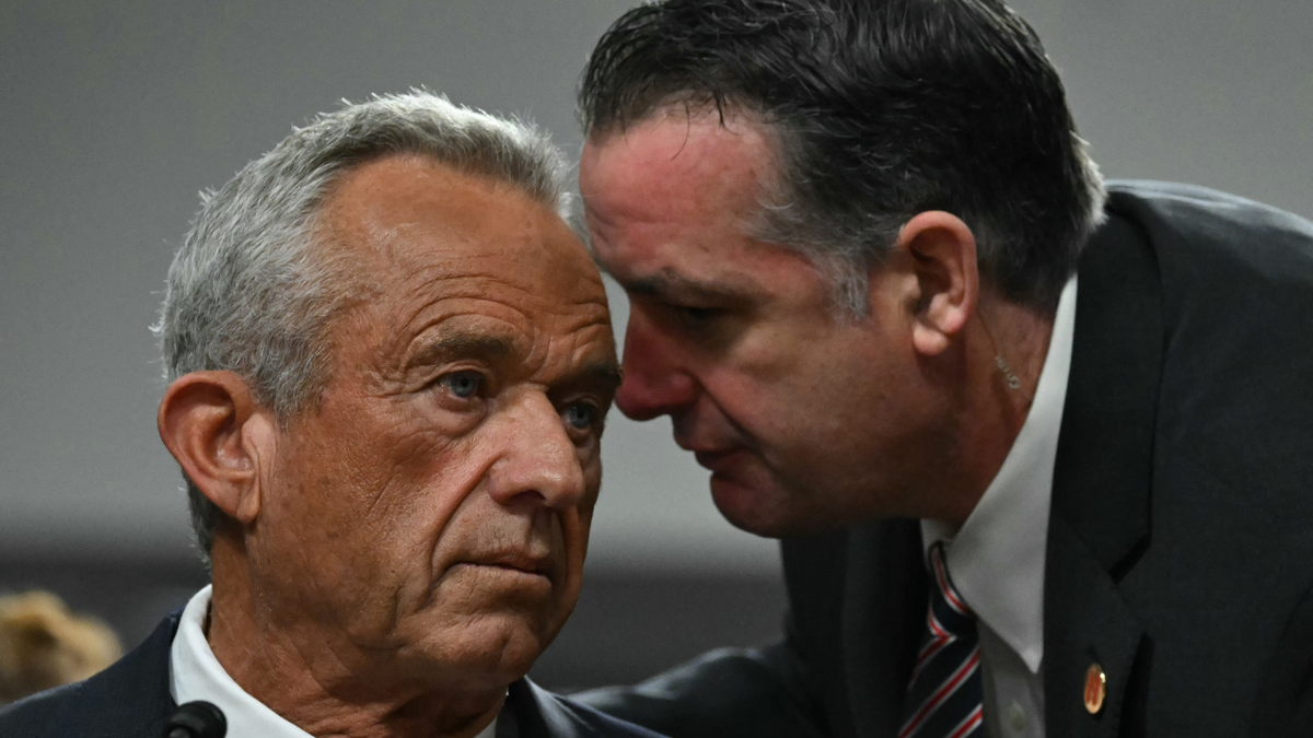 US Secretary of Health and Human Services nominee Robert F. Kennedy Jr. (L) confers with an adjutant  during a Senate Finance Committee proceeding  connected  his information   to beryllium  Health and Human Services Secretary, connected  Capitol Hill successful  Washington, DC, January 29, 2025. (Photo by ANDREW CABALLERO-REYNOLDS / AFP) (Photo by ANDREW CABALLERO-REYNOLDS/AFP via Getty Images)