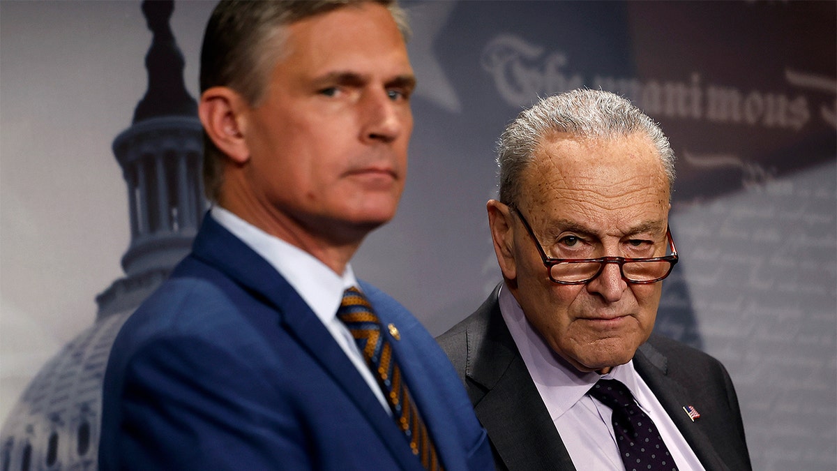 Senate Minority Leader Chuck Schumer and Sen. Martin Heinrich pictured astatine  a property   conference