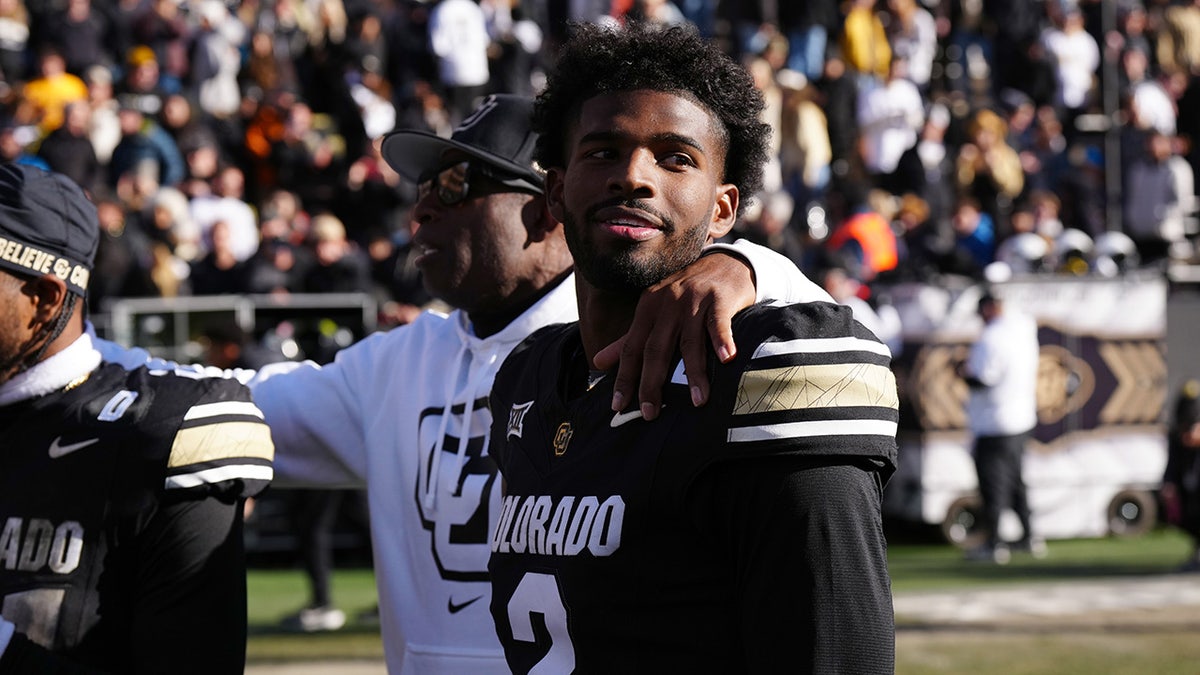 Shedeur Sanders with his father