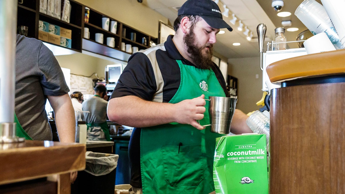 Starbucks barista working behind the counter