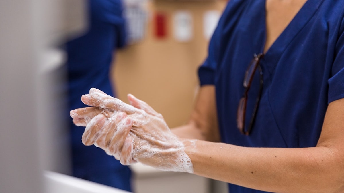 Doctor scrubbing out