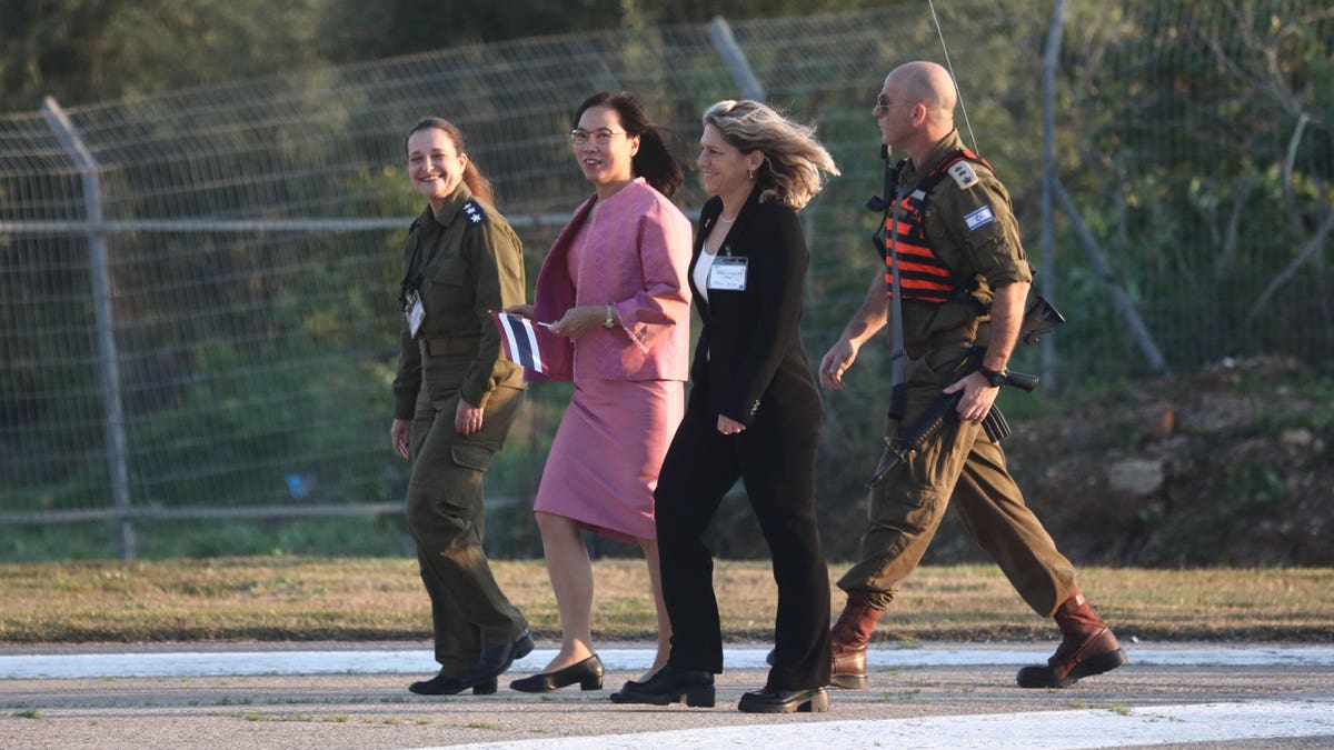 Thailand's Ambassador to Israel, Pannabha Chandraramya, greets five Thai hostages arriving at the Shamir Medical Center in Be'er Yaakov on Jan. 30, 2025 after being held captive in Gaza for 482 days.