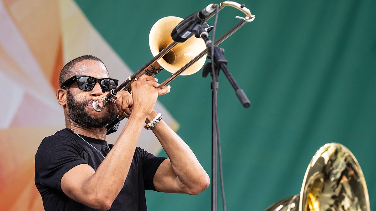 Tombone Shorty playing at the New Orleans Jazz & Heritage Festival of 2024