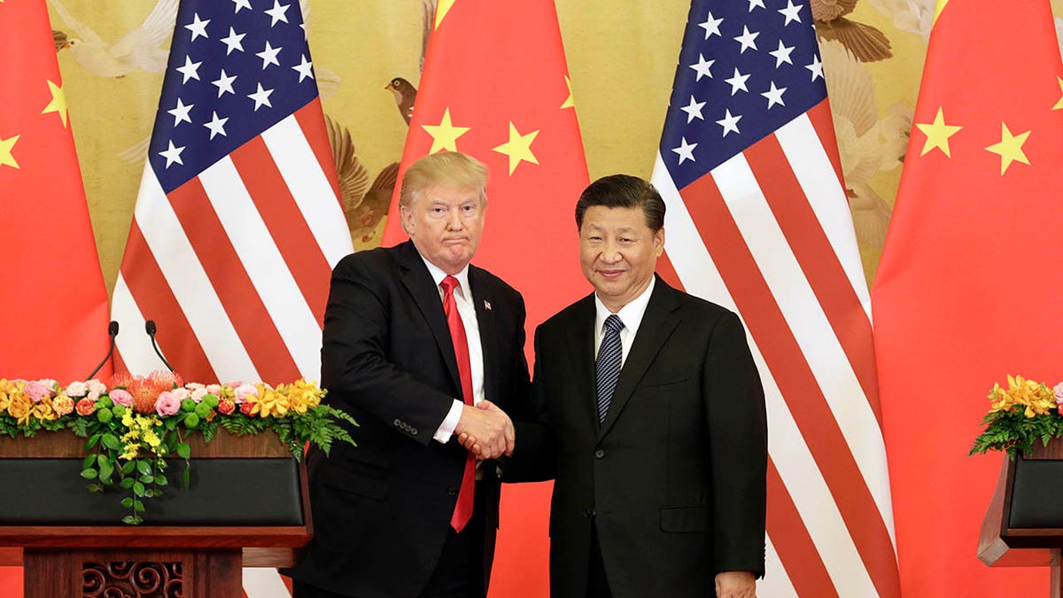 Trump está apertando a mão de Xi