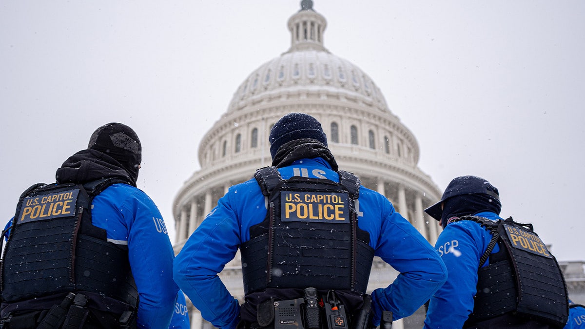 The Dome of the U.S. Capitol Building with U.S. Capitol Police officers