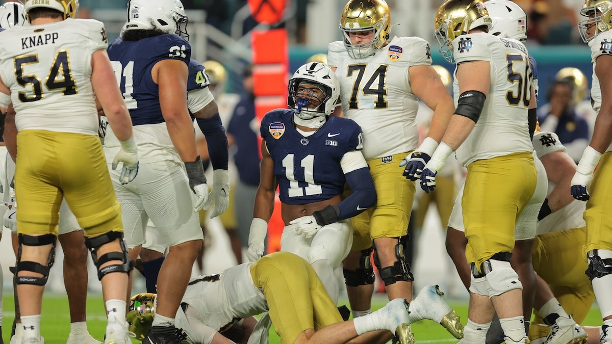 Penn State Nittany Lions defensive end Abdul Carter (11) celebrates a tackle on Notre Dame Fighting Irish quarterback Riley Leonard (13) in the first half at Hard Rock Stadium.