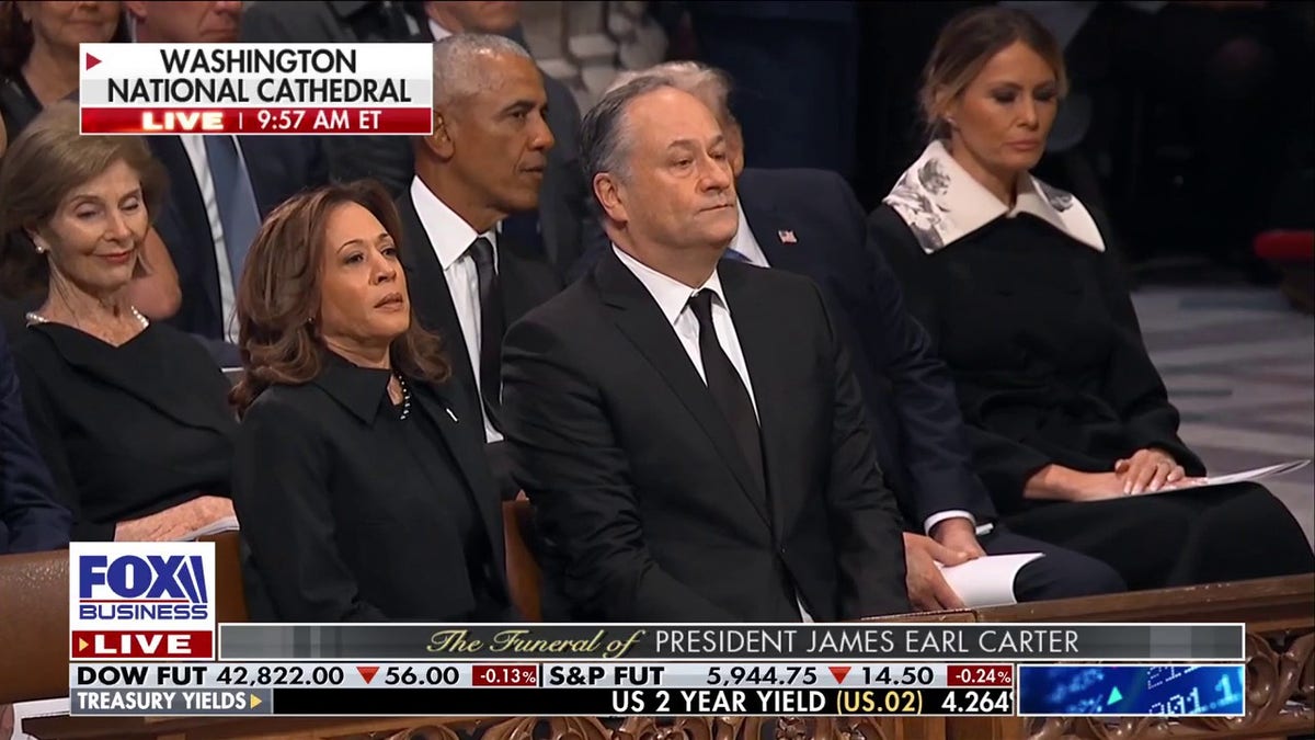 Harris and Emhoff seated at funeral