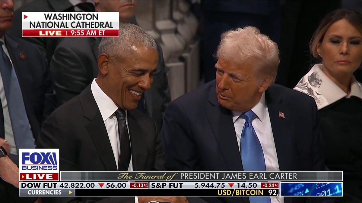 Obama laughs, left, as Trump talks to him