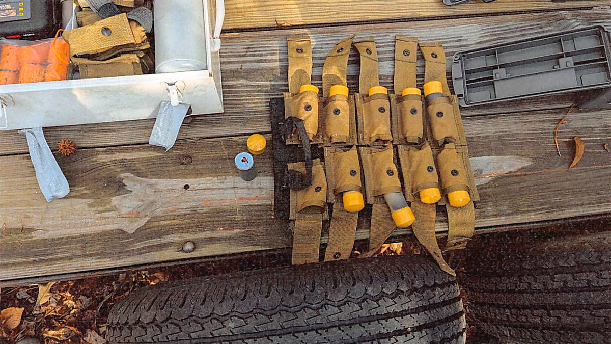 A stockpile of homemade explosives that federal agents seized when they arrested Brad Spafford in December 2024 was laid out on a table.