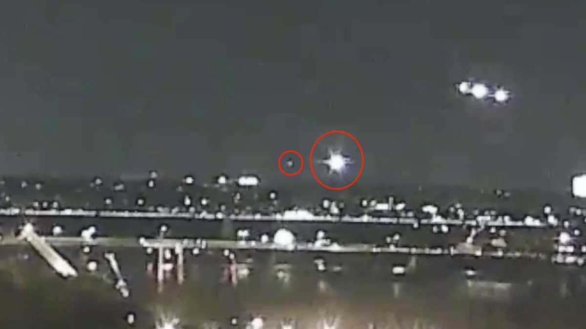 The video seems to show an outdoor plane crash at Reagan Washington National