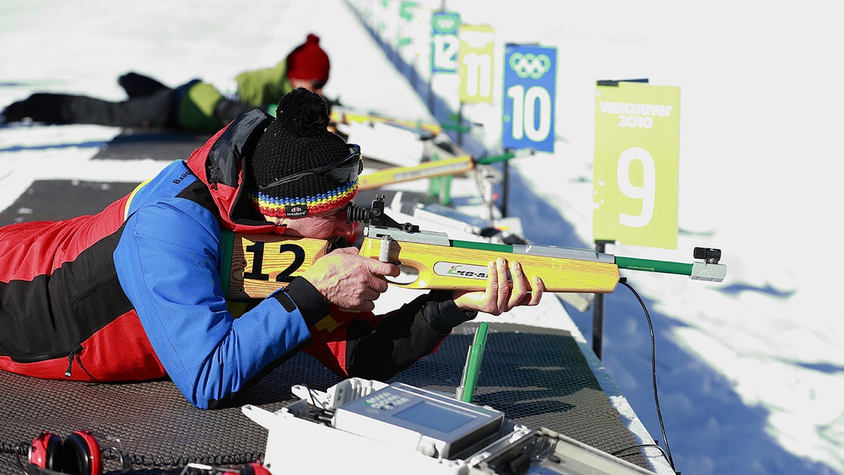 Competitors fire rifles in Invictus Winter Games training