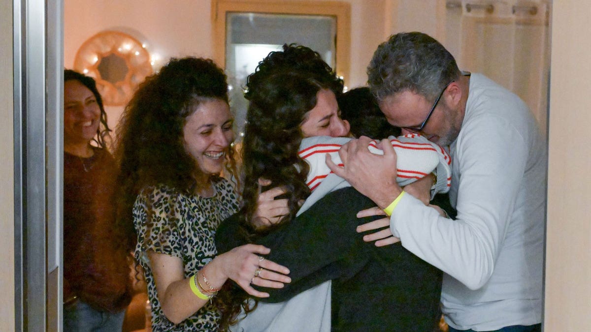 Yarden (left) embraces Romi upon her release from Gaza. Romi was kept hostage by Hamas terrorists for 471 days.