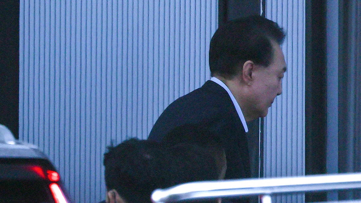 South Korean impeached President Yoon Suk Yeol arrives at the complex building housing the Corruption Investigation Office for High-ranking Officials (CIO) in Gwacheon on Jan. 15, 2025. Yoon was arrested on Jan. 15 over his failed martial law bid, after hundreds of anti-graft investigators and police raided his residence to end a weeks-long standoff. 