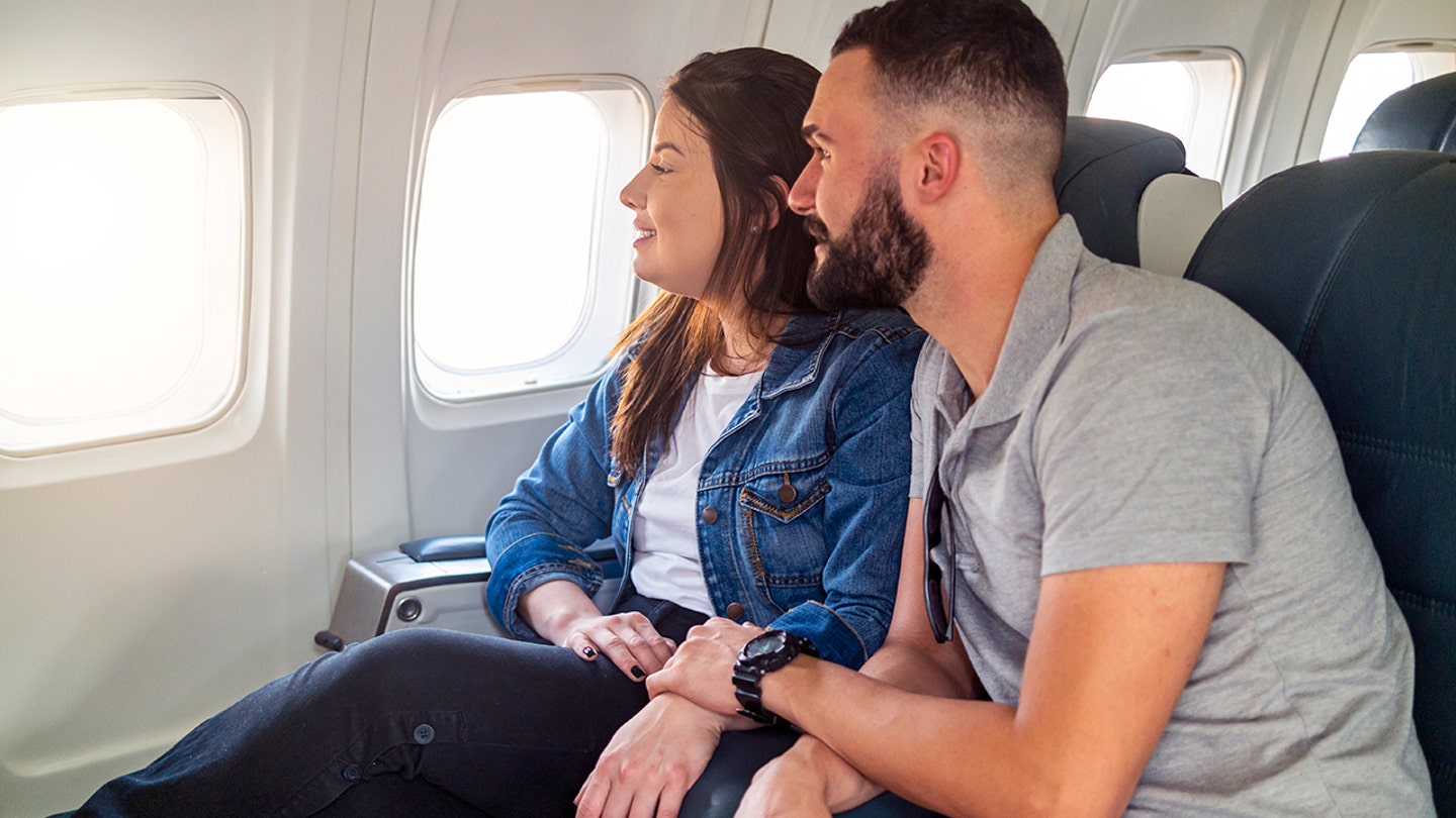 couple sitting on plane together