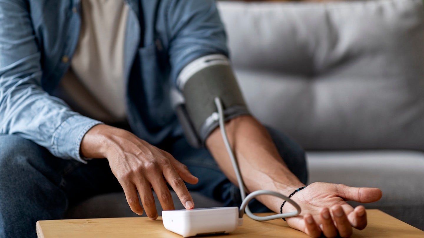 man taking blood pressure