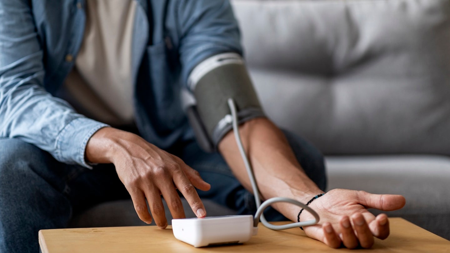 man taking blood pressure