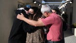 Arbel Yehoud's family hug her upon her release from Gaza on Thursday.