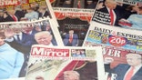 Newspapers with photos of Donald Trump are piled up ahead of his inauguration.