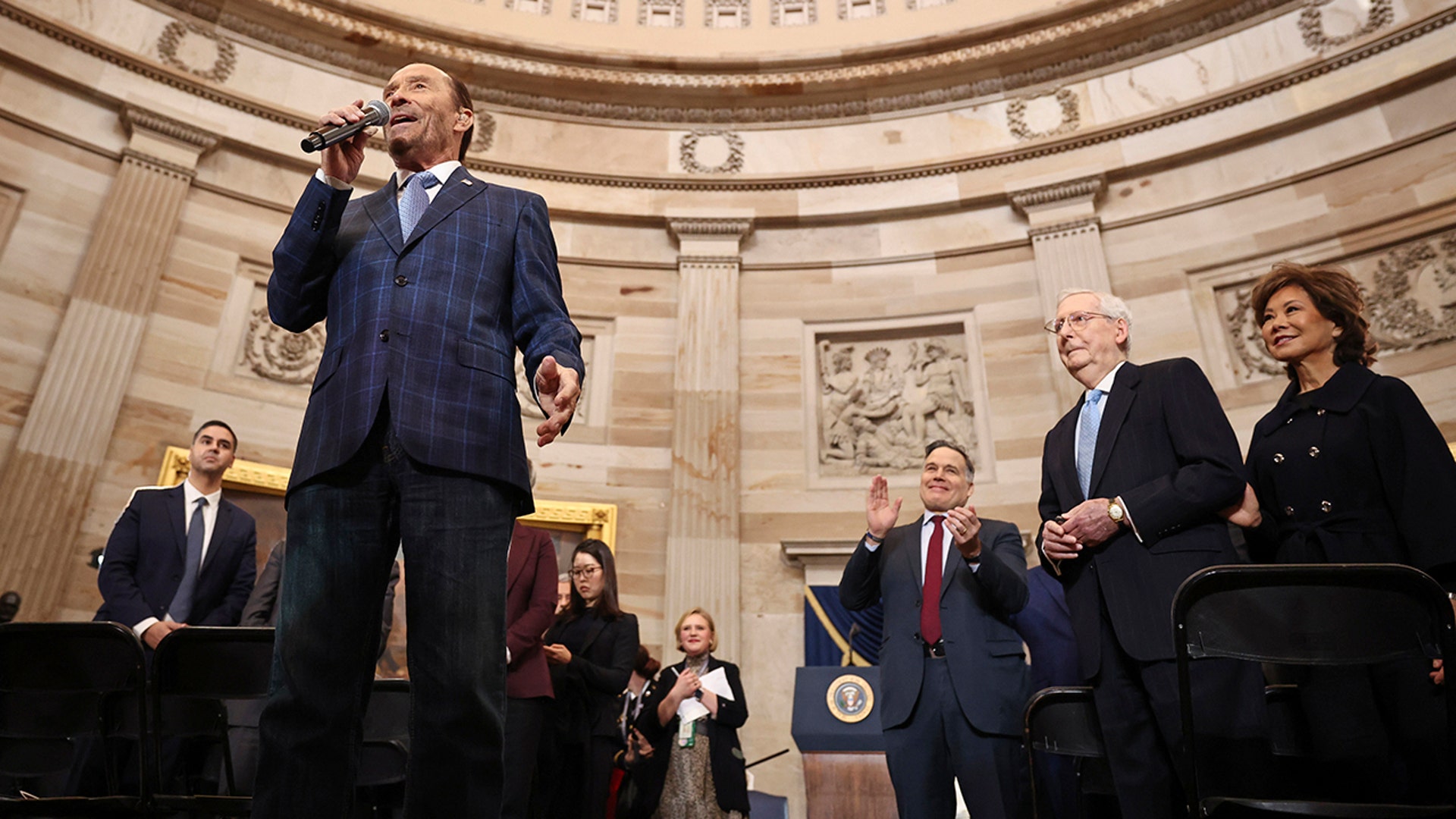 Lee Greenwood performs in the Rotunda in front of Senator Mitch McConnell and his wife