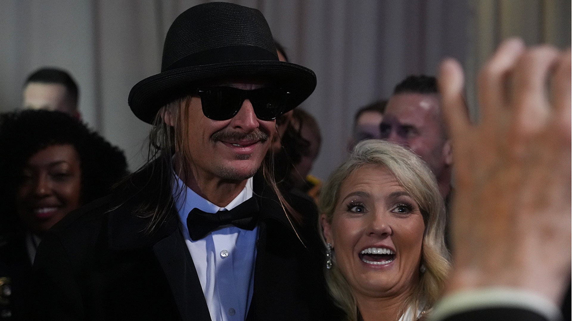 Kid Rock posing with a guest while posing for photos at the Commander in Chief Ball.