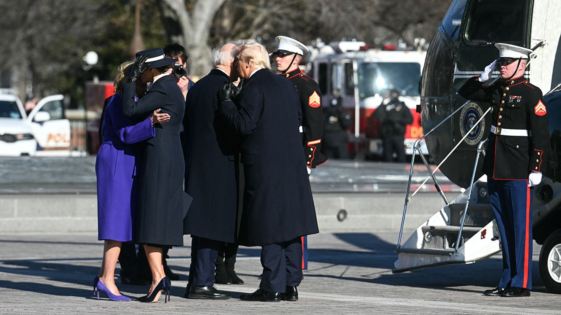 US President Donald Trump and First Lady Melania Trump participate in a departure ceremony for former President Joe Biden and former First Lady Jill Biden, before the Bidens board a helicopter outside the US Capitol