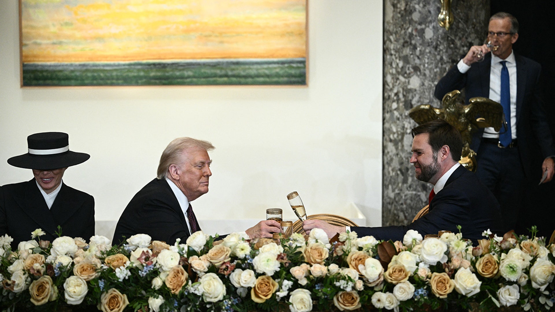 Donald Trump and Vice President J.D. Vance clink glasses