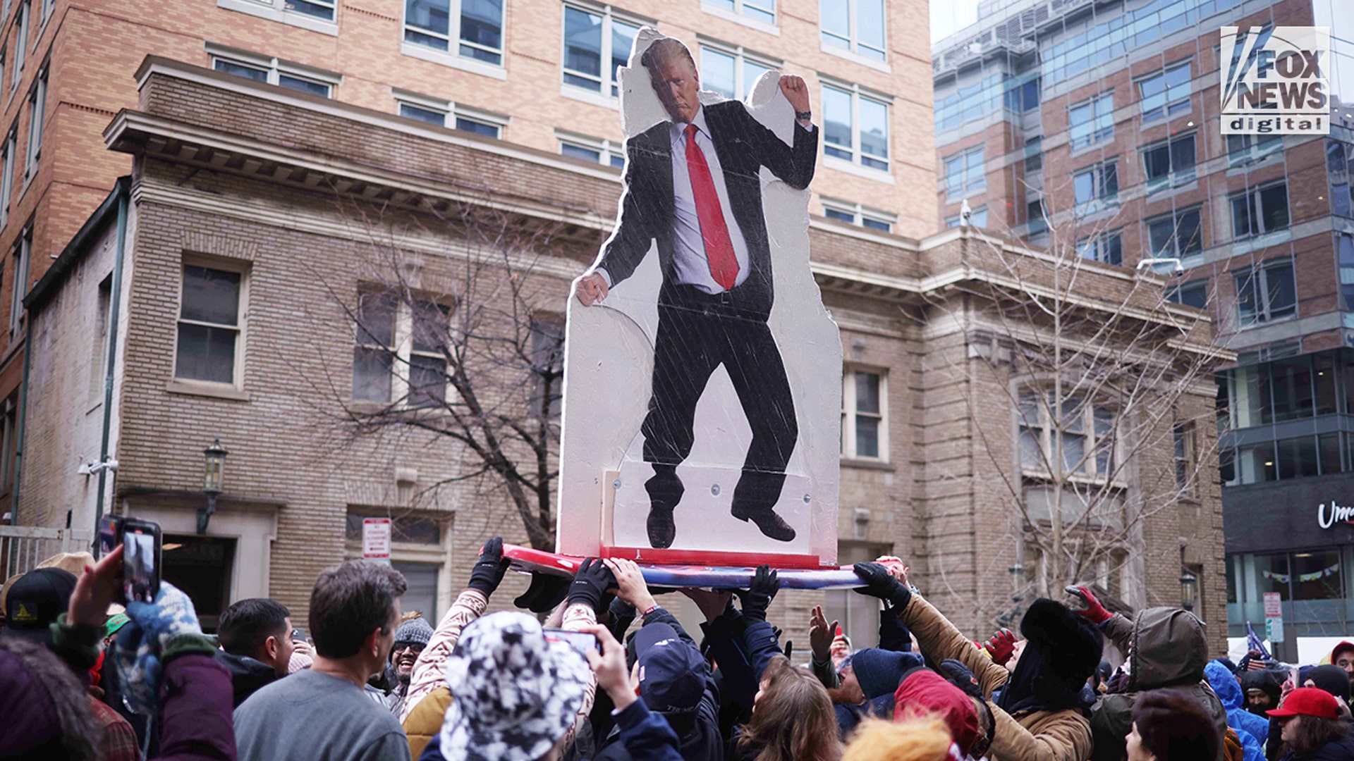 Donald Trump supporters await entry to his Inauguration Day Eve rally