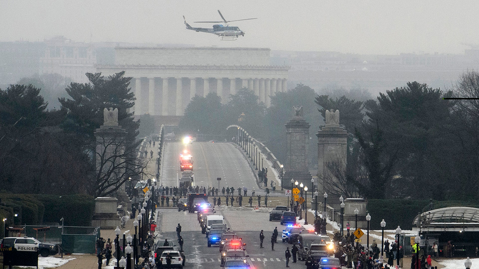 The motorcade of President-elect Donald Trump crosses over the Memorial Bridge en route to a wreath laying ceremony at Arlington National Cemetery