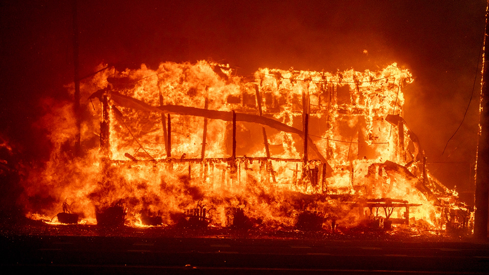 A structure burns during the Palisades Fire in the Pacific Palisades neighborhood of Los Angeles, Tuesday, Jan. 7, 2025.