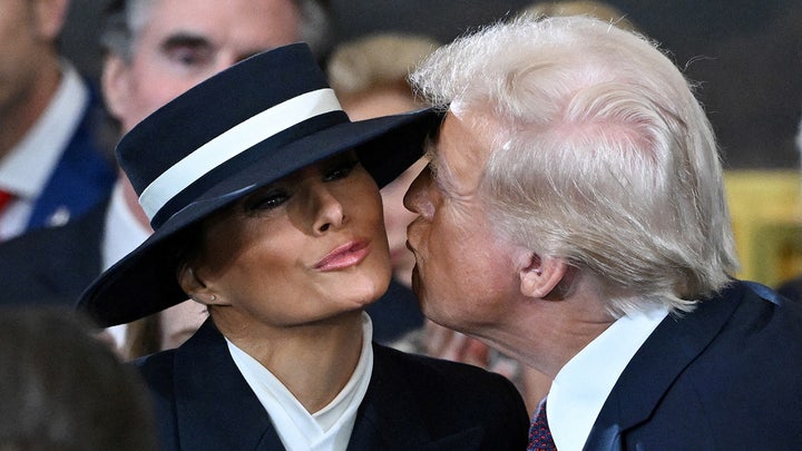 Trump attempts to kiss Melania as he enters the swearing-in ceremony 