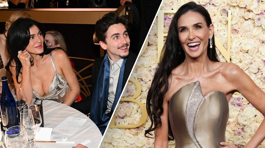 Demi Moore walks the red carpet in a gold dress at the 2025 Golden Globes