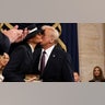 U.S. President-elect Donald Trump greets Melania Trump as he arrives for inauguration ceremonies