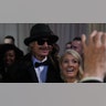 Kid Rock posing with a guest while posing for photos at the Commander in Chief Ball.