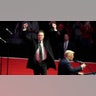 Elon Musk reacts as President-elect Donald Trump speaks at a rally ahead