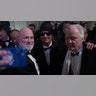 Jon Voight and Kid Rock pose with a fan while at the Commander in Chief Ball on President Donald Trump's inauguration day.