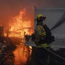 Firefighters in the Palisades at a home