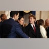 Senator Marco Rubio shakes hands with Facebook CEO Mark Zuckerberg who stands next to his wife Priscilla Chan