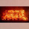 A structure burns during the Palisades Fire in the Pacific Palisades neighborhood of Los Angeles, Tuesday, Jan. 7, 2025.