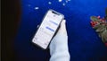 A woman recovering a deleted text on her iPhone - Fox News