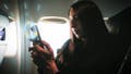 A woman using AST SpaceMobile on her smartphone - Fox News