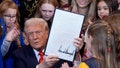 President Donald Trump signs an executive order barring transgender female athletes from competing in women's or girls' sporting events, in the East Room of the White House, Wednesday, Feb. 5, 2025, in Washington. - Fox News