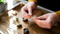 Close-up of a unrecognizable man's hands preparing a joint of marijuana. - Fox News