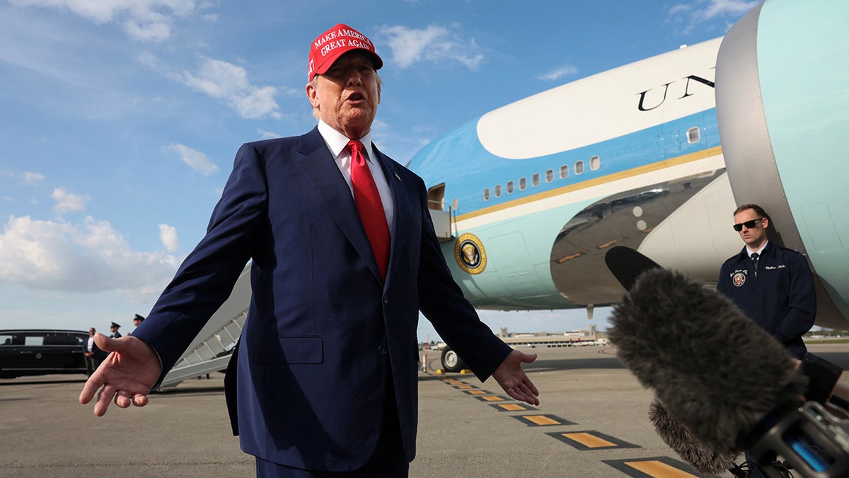 US President Donald Trump speaks to reporter West Palm Beach