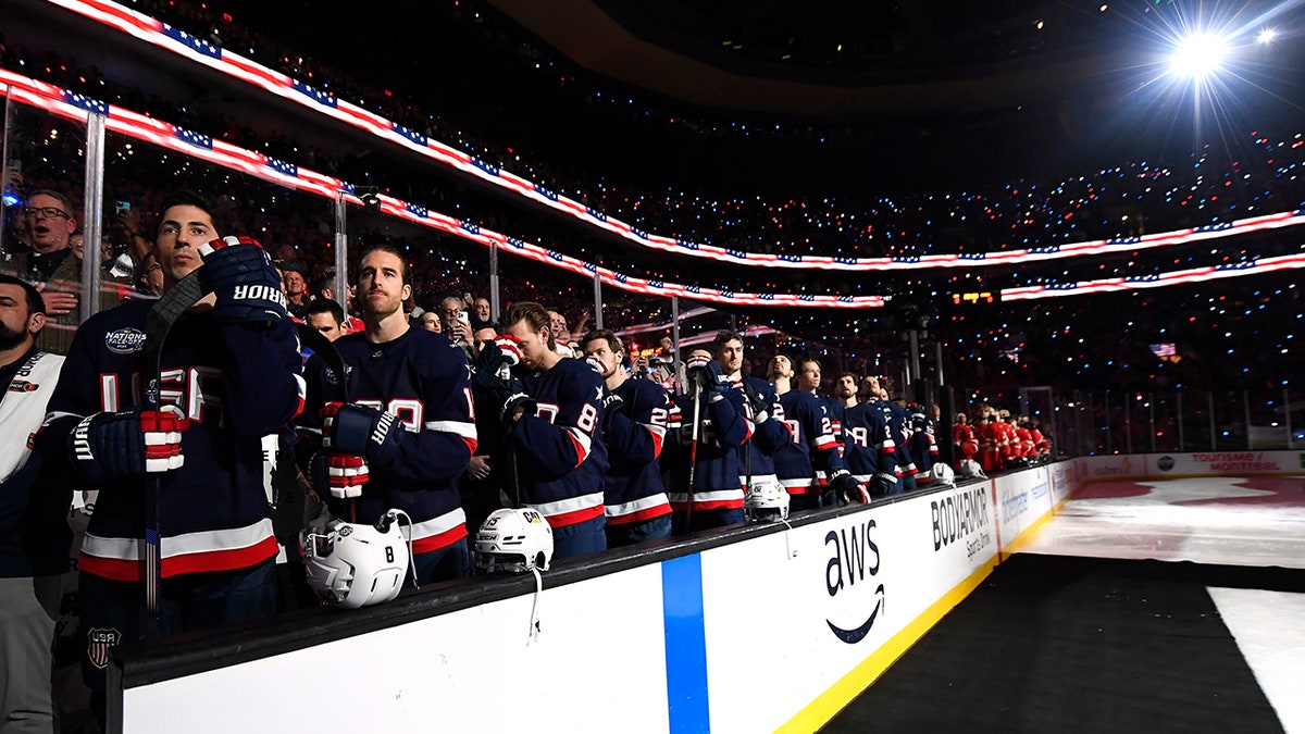 US players listen to the anthem